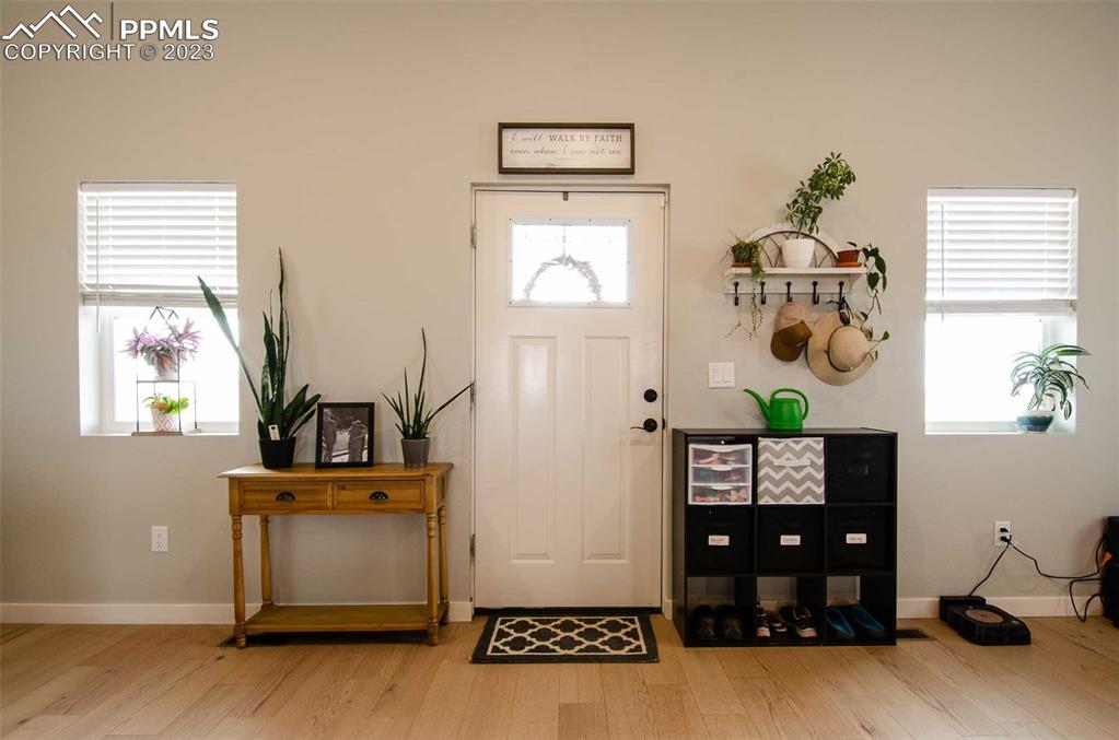 16750 Rabbit Track Trail Colorado Springs, CO 80930 - Photo 3 of 50 a living room with furniture and a window