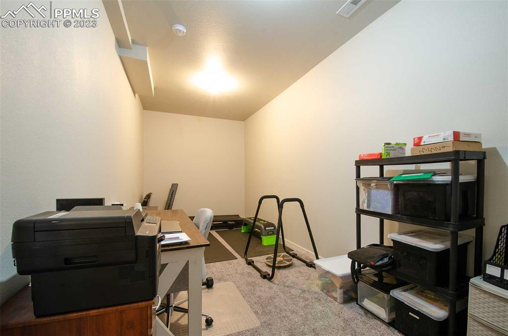 16750 Rabbit Track Trail Colorado Springs, CO 80930 - Photo 38 of 50 a view of a workspace with furniture