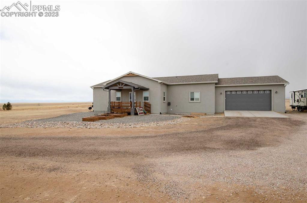 16750 Rabbit Track Trail Colorado Springs, CO 80930 - Photo 39 of 50 a view of a house with a ocean view