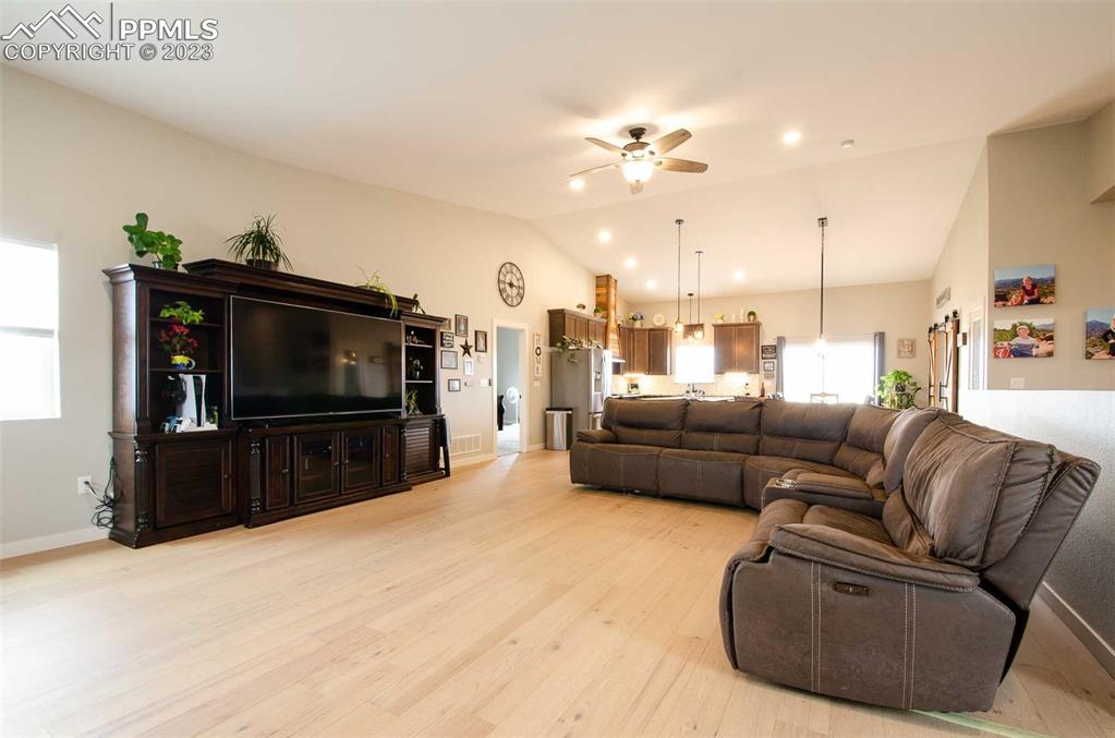 16750 Rabbit Track Trail Colorado Springs, CO 80930 - Photo 4 of 50 a living room with furniture and a flat screen tv