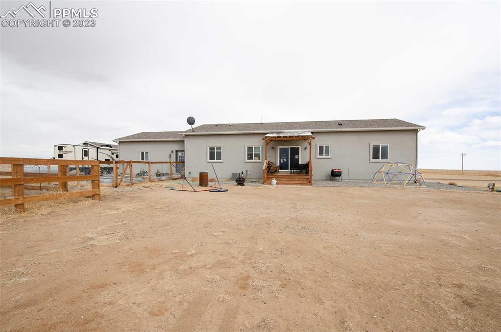 16750 Rabbit Track Trail Colorado Springs, CO 80930 - Photo 42 of 50 a view of the house with backyard