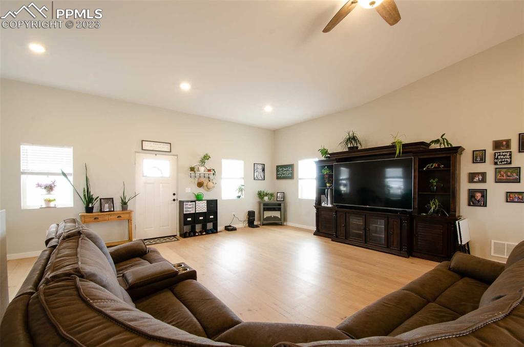 16750 Rabbit Track Trail Colorado Springs, CO 80930 - Photo 7 of 50 a room with furniture and a flat screen tv