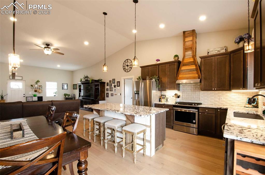 16750 Rabbit Track Trail Colorado Springs, CO 80930 - Photo 10 of 50 a large kitchen with a table and chairs