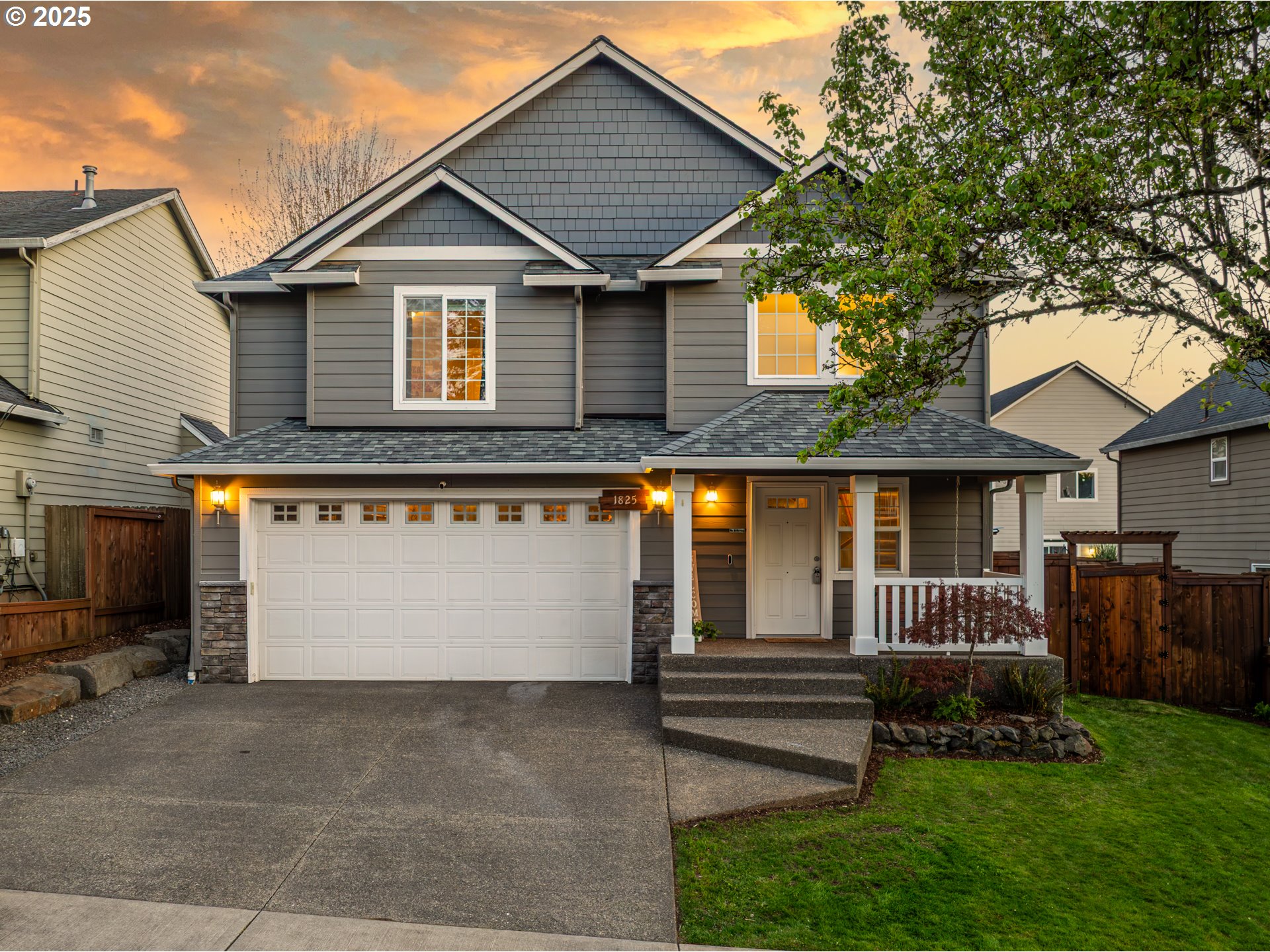 1825 North 9th Way Ridgefield, WA 98642 - Photo 1 of 30 a front view of a house with garage