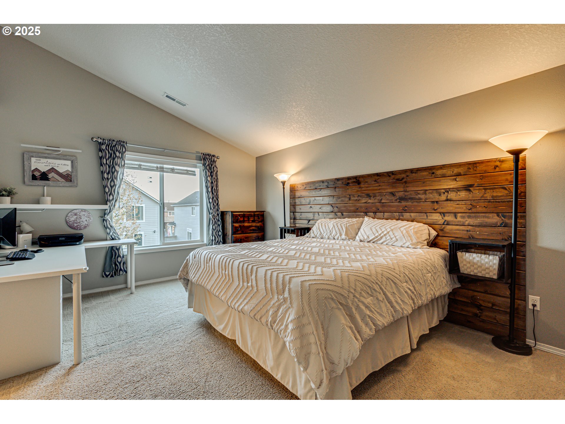 1825 North 9th Way Ridgefield, WA 98642 - Photo 13 of 30 a bedroom with a large bed and a desk
