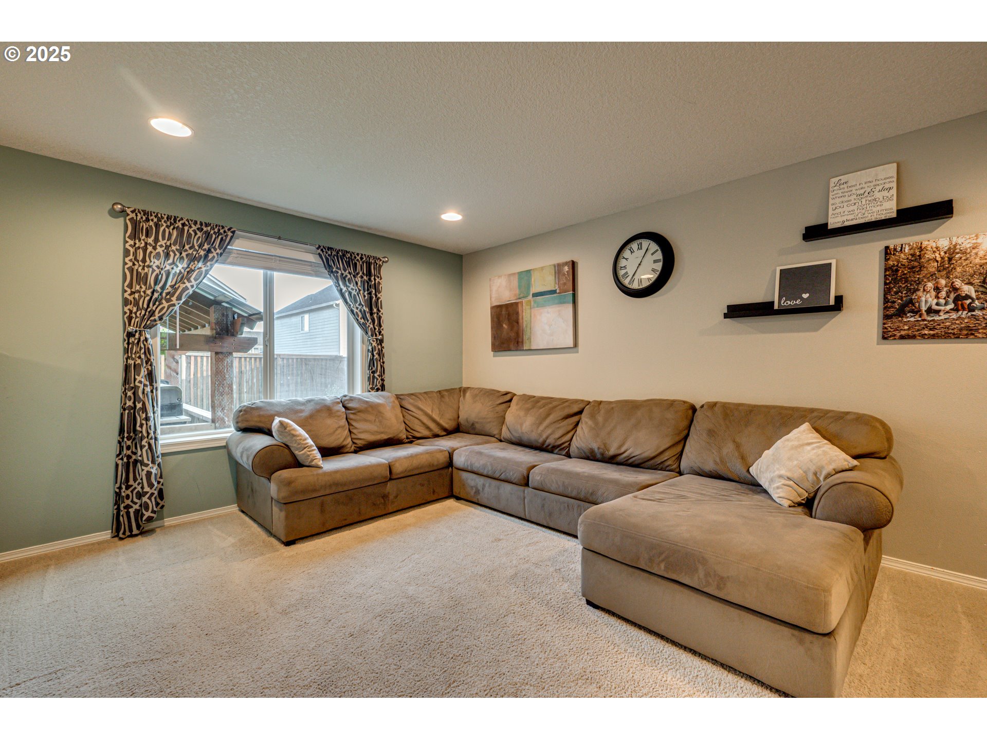1825 North 9th Way Ridgefield, WA 98642 - Photo 10 of 30 a living room with furniture and a large window