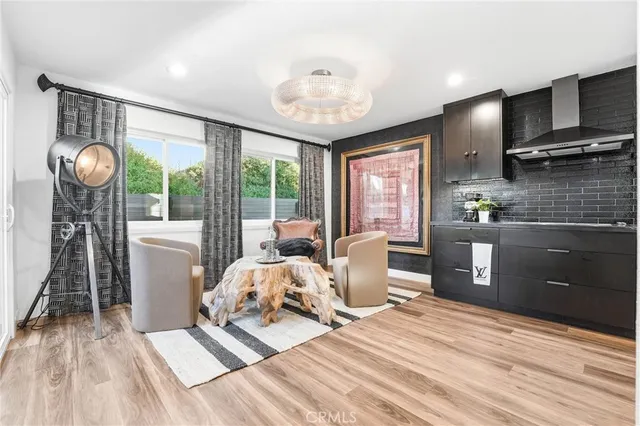a bedroom with furniture and a wooden floor