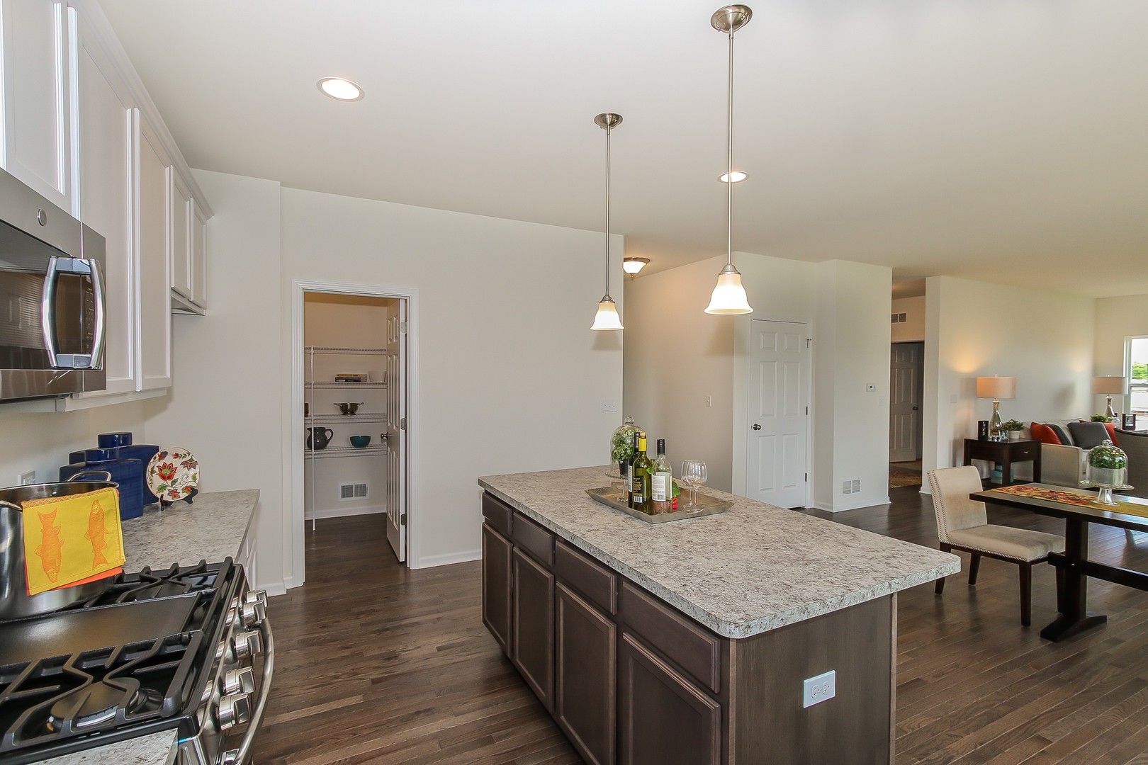 440 Radcliff Lane South Elgin, IL 60177 - Photo 11 of 31 a kitchen with stainless steel appliances microwave stove refrigerator and wooden floor