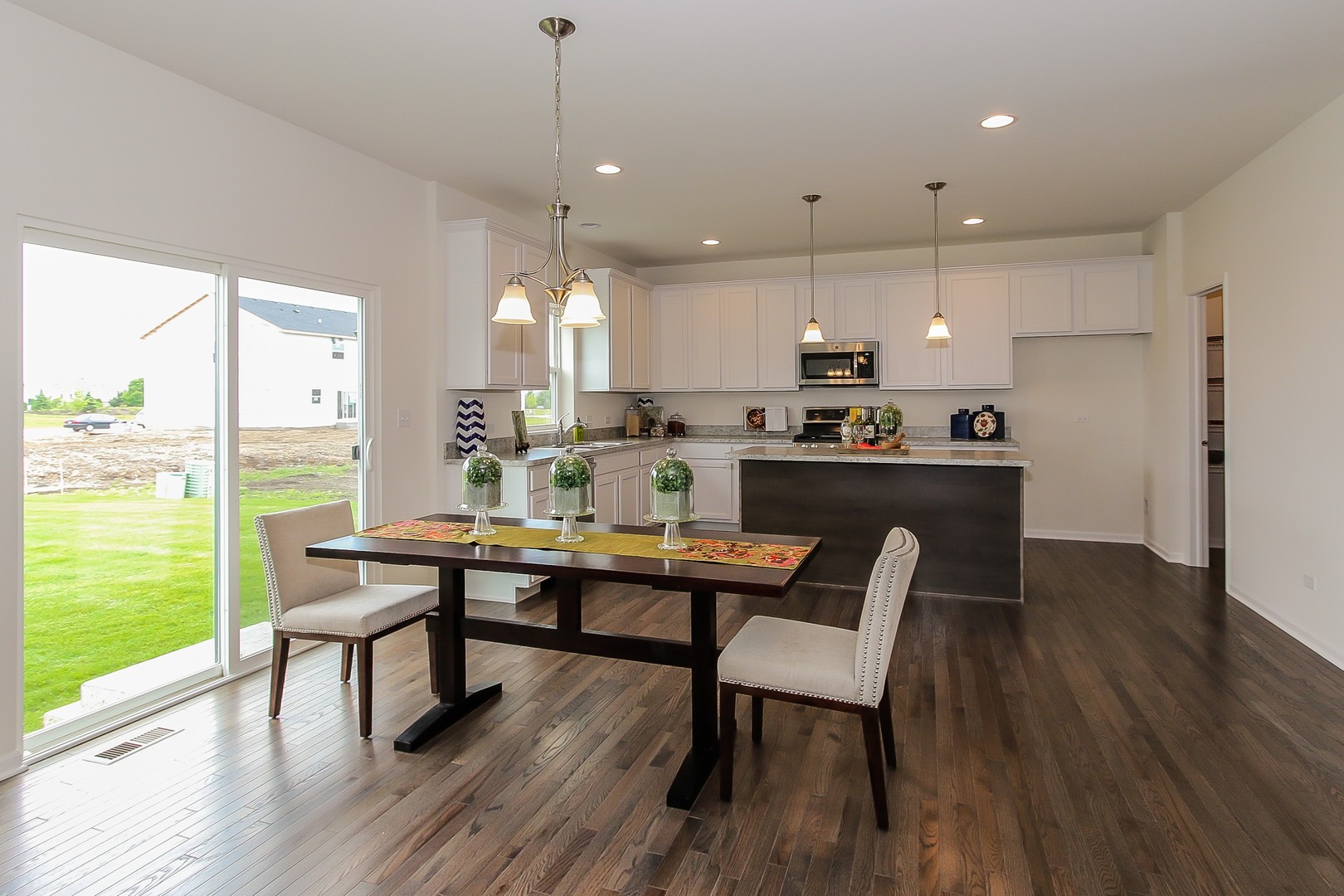 440 Radcliff Lane South Elgin, IL 60177 - Photo 14 of 31 a view of a dining room with furniture window and wooden floor