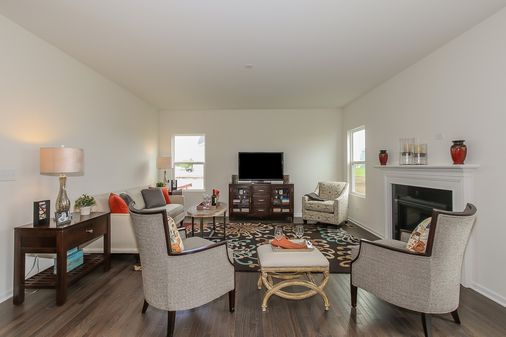 440 Radcliff Lane South Elgin, IL 60177 - Photo 15 of 31 a living room with furniture a flat screen tv and a fireplace