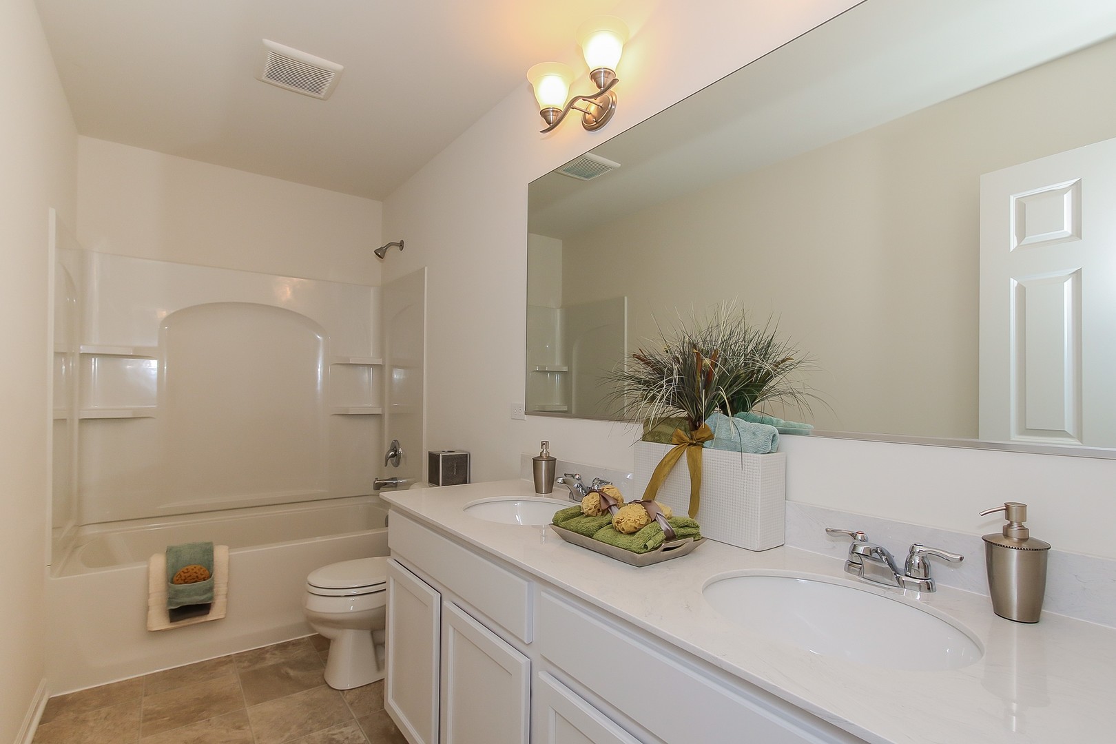 440 Radcliff Lane South Elgin, IL 60177 - Photo 28 of 31 a bathroom with a granite countertop sink a toilet and a mirror