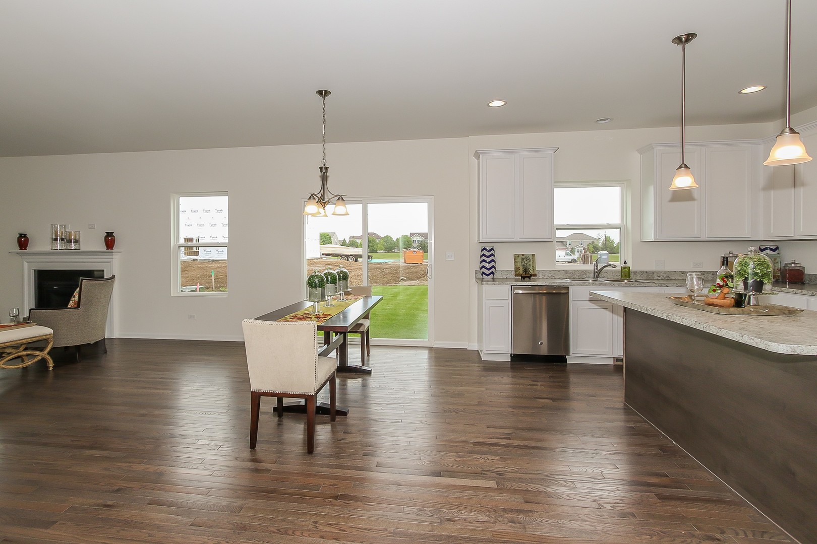 440 Radcliff Lane South Elgin, IL 60177 - Photo 10 of 31 a kitchen with stainless steel appliances a dining table chairs stove a refrigerator and cabinets