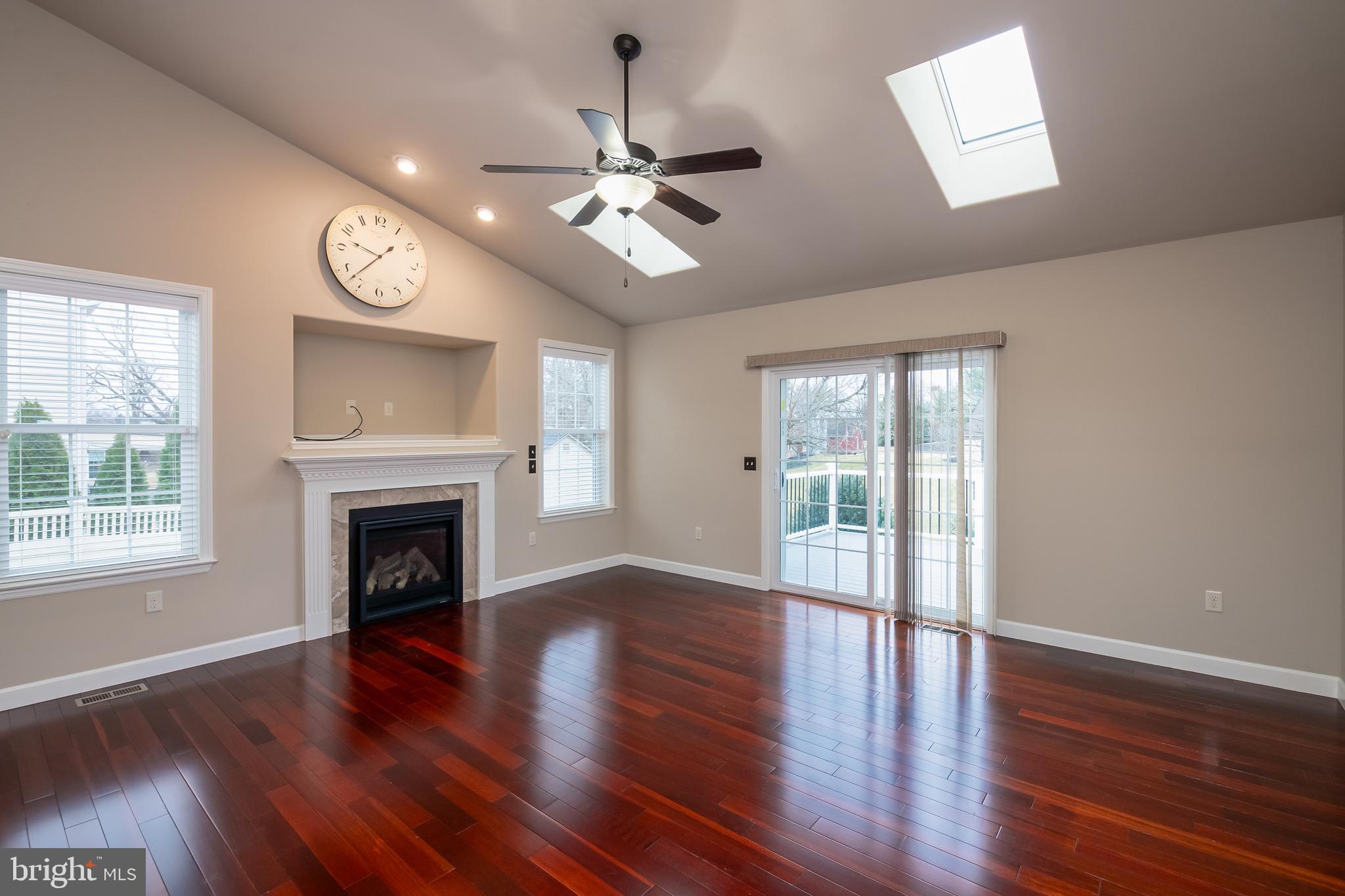 654 Ebersole Road Reading, PA 19605 - Photo 11 of 27 a view of an empty room with wooden floor and a window