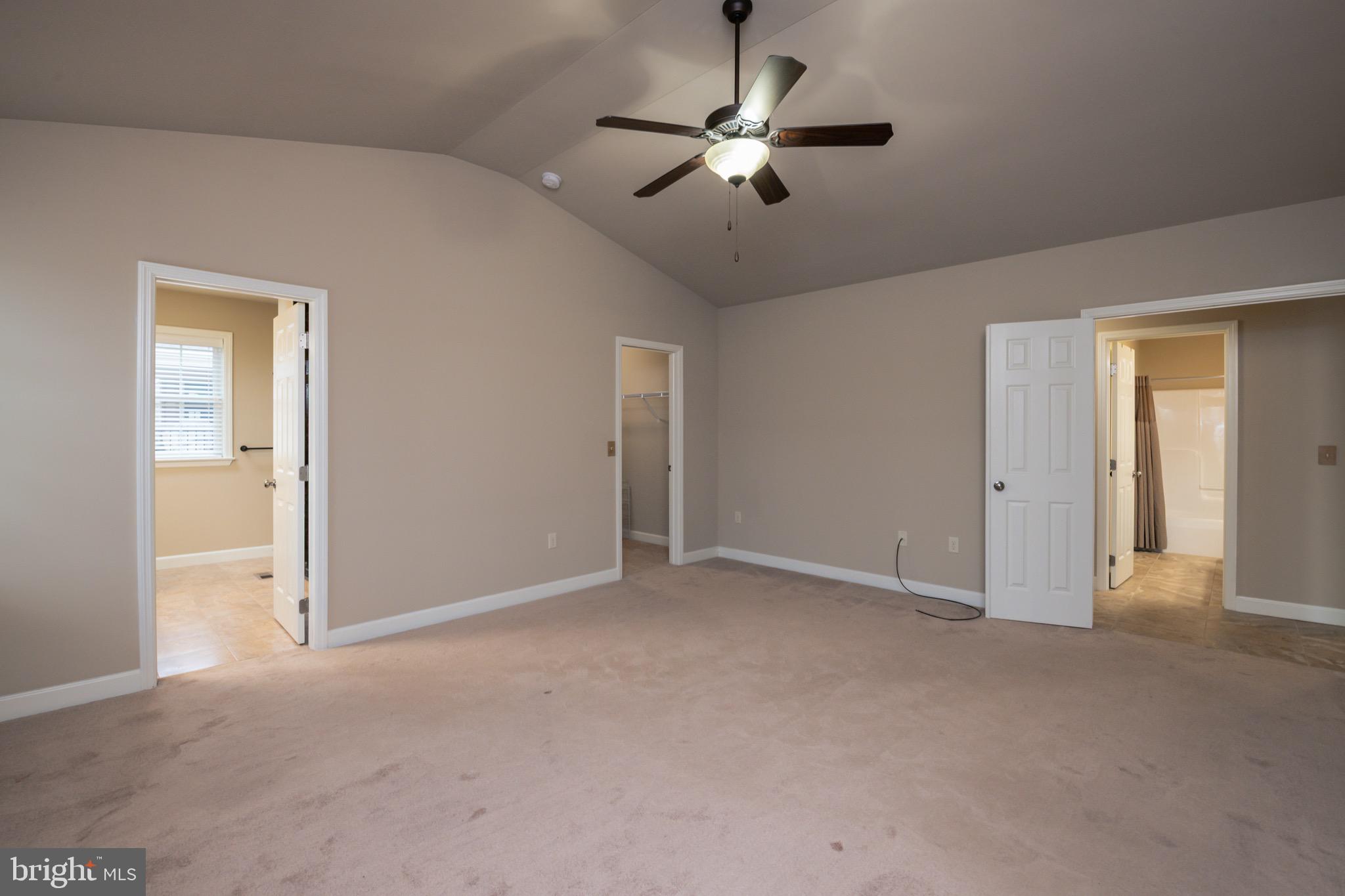654 Ebersole Road Reading, PA 19605 - Photo 14 of 27 an empty room with chandelier fan and windows