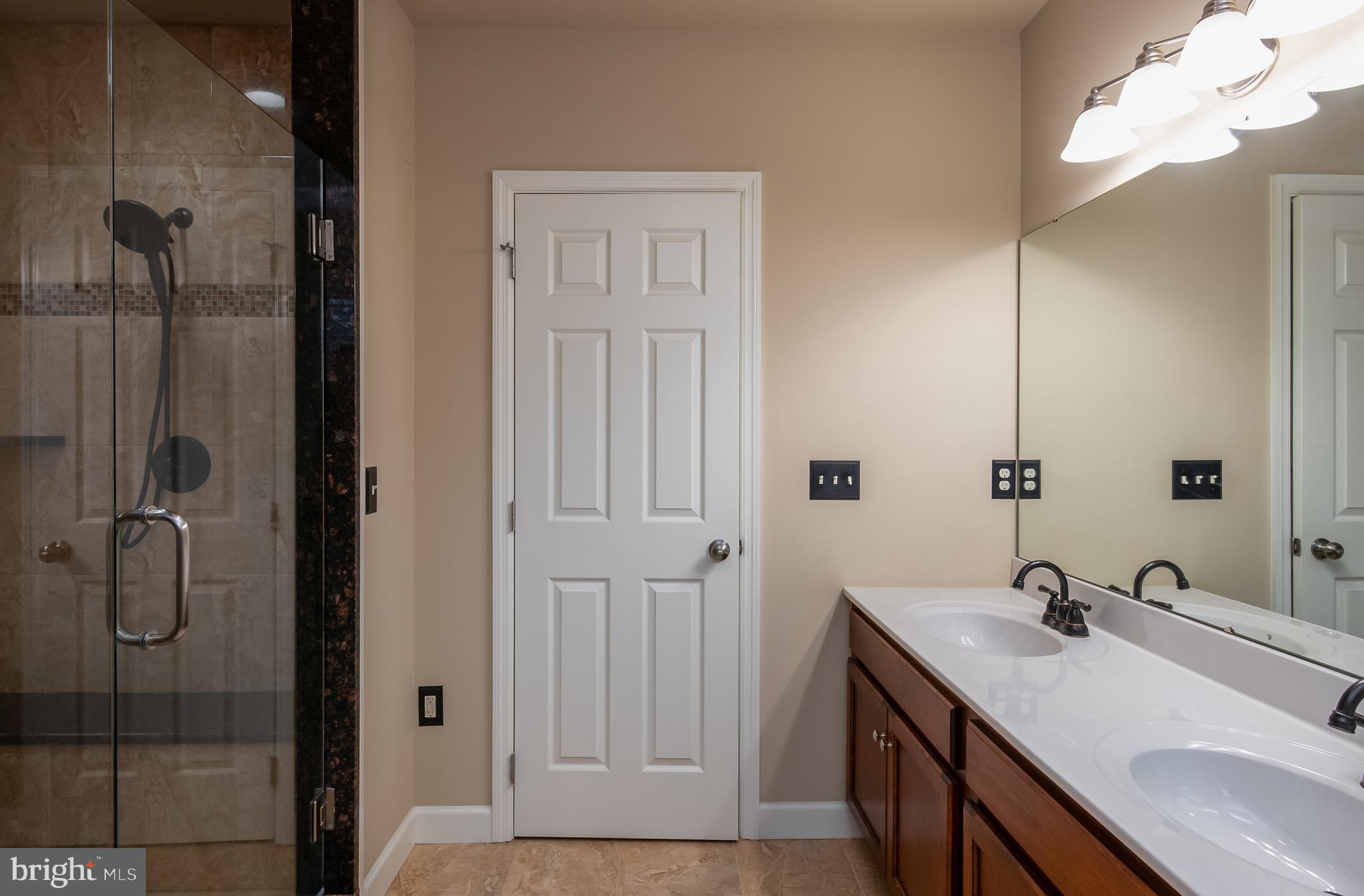 654 Ebersole Road Reading, PA 19605 - Photo 16 of 27 a bathroom with a sink and mirror