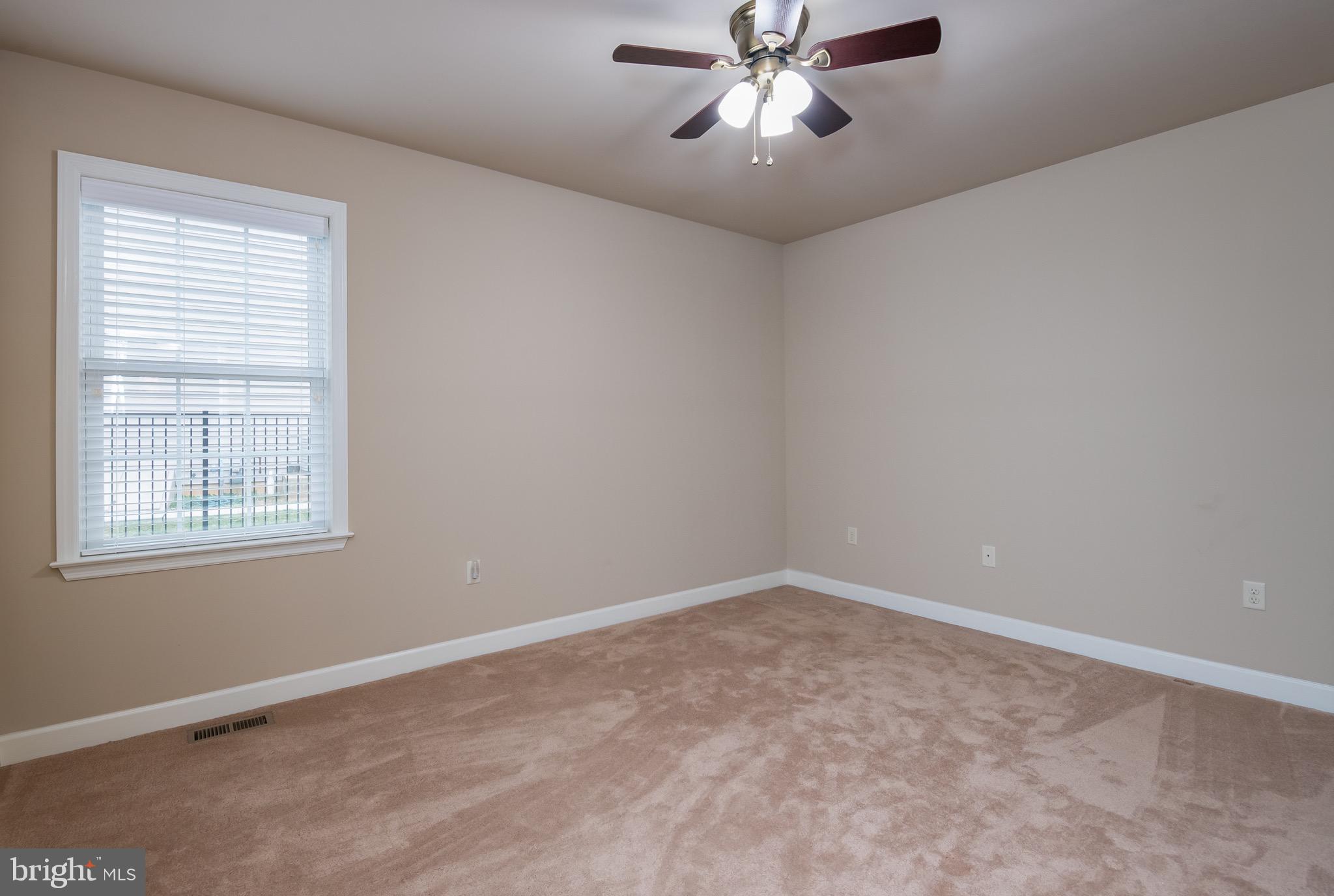 654 Ebersole Road Reading, PA 19605 - Photo 20 of 27 a view of an empty room with a window