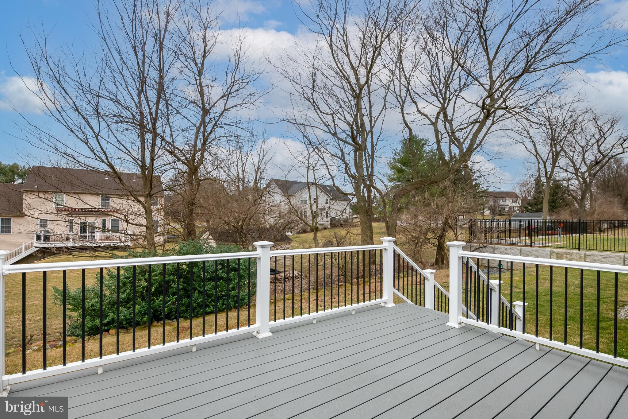 654 Ebersole Road Reading, PA 19605 - Photo 26 of 27 a view of a wooden deck and a yard
