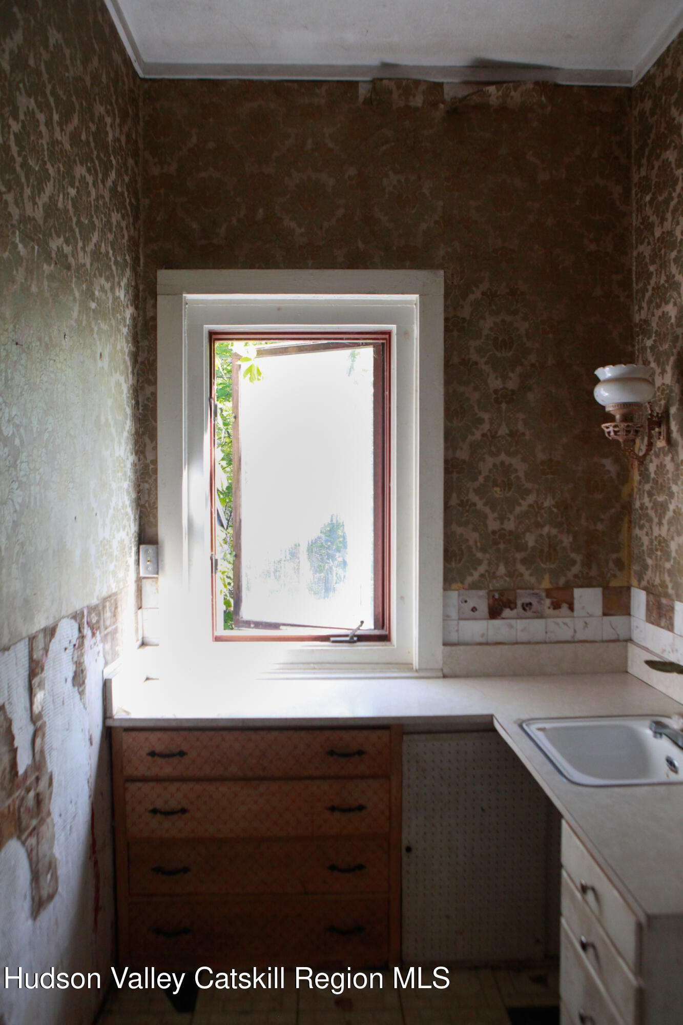 76 Meads Mountain Road Woodstock, NY 12498 - Photo 15 of 28 a bathroom with a sink a mirror and a window