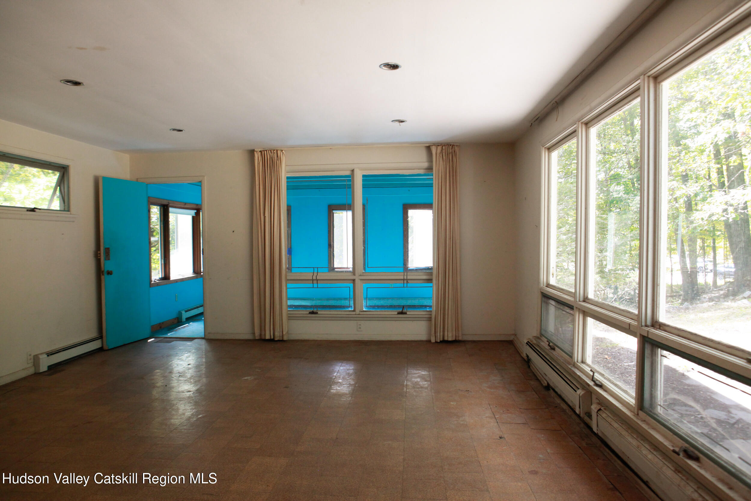 76 Meads Mountain Road Woodstock, NY 12498 - Photo 16 of 28 a view of an empty room with glass door