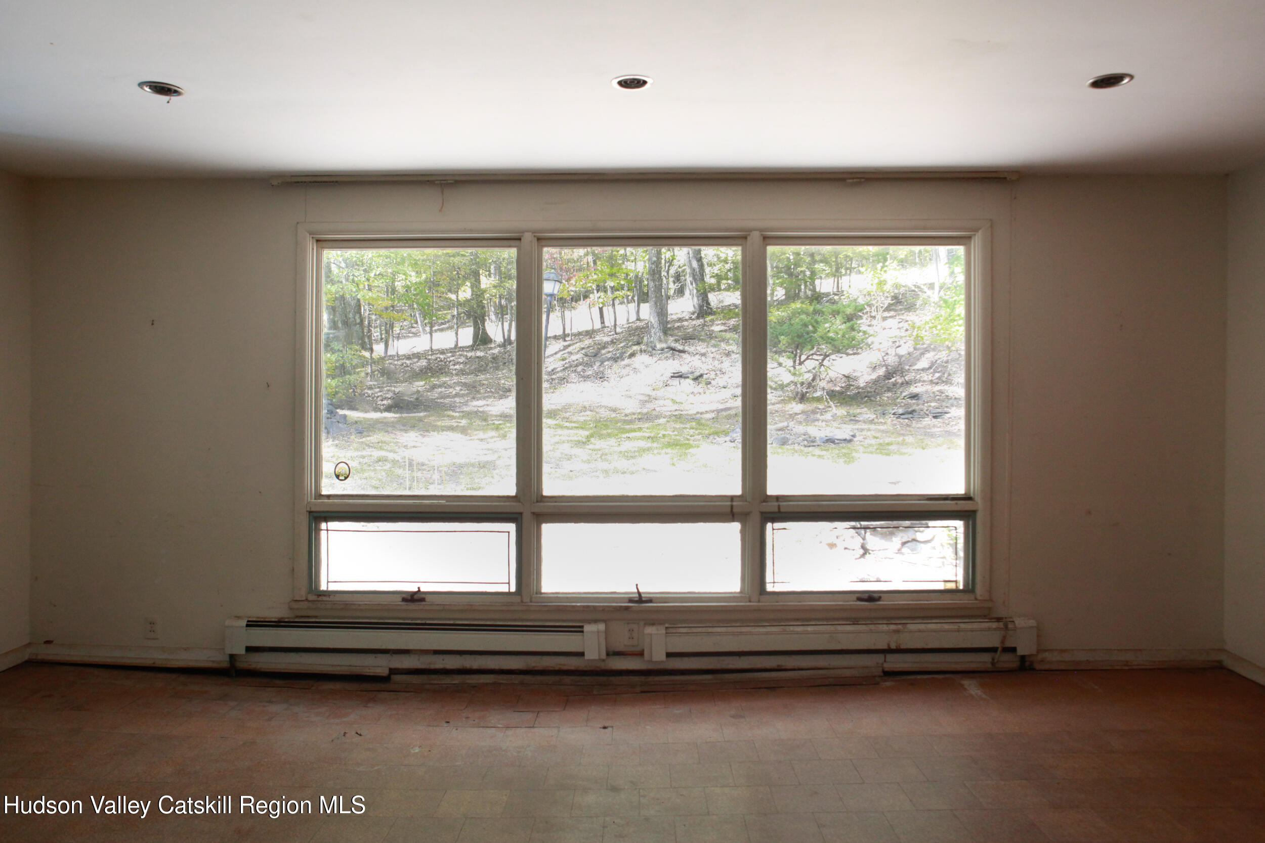 76 Meads Mountain Road Woodstock, NY 12498 - Photo 17 of 28 a view of empty room with large window