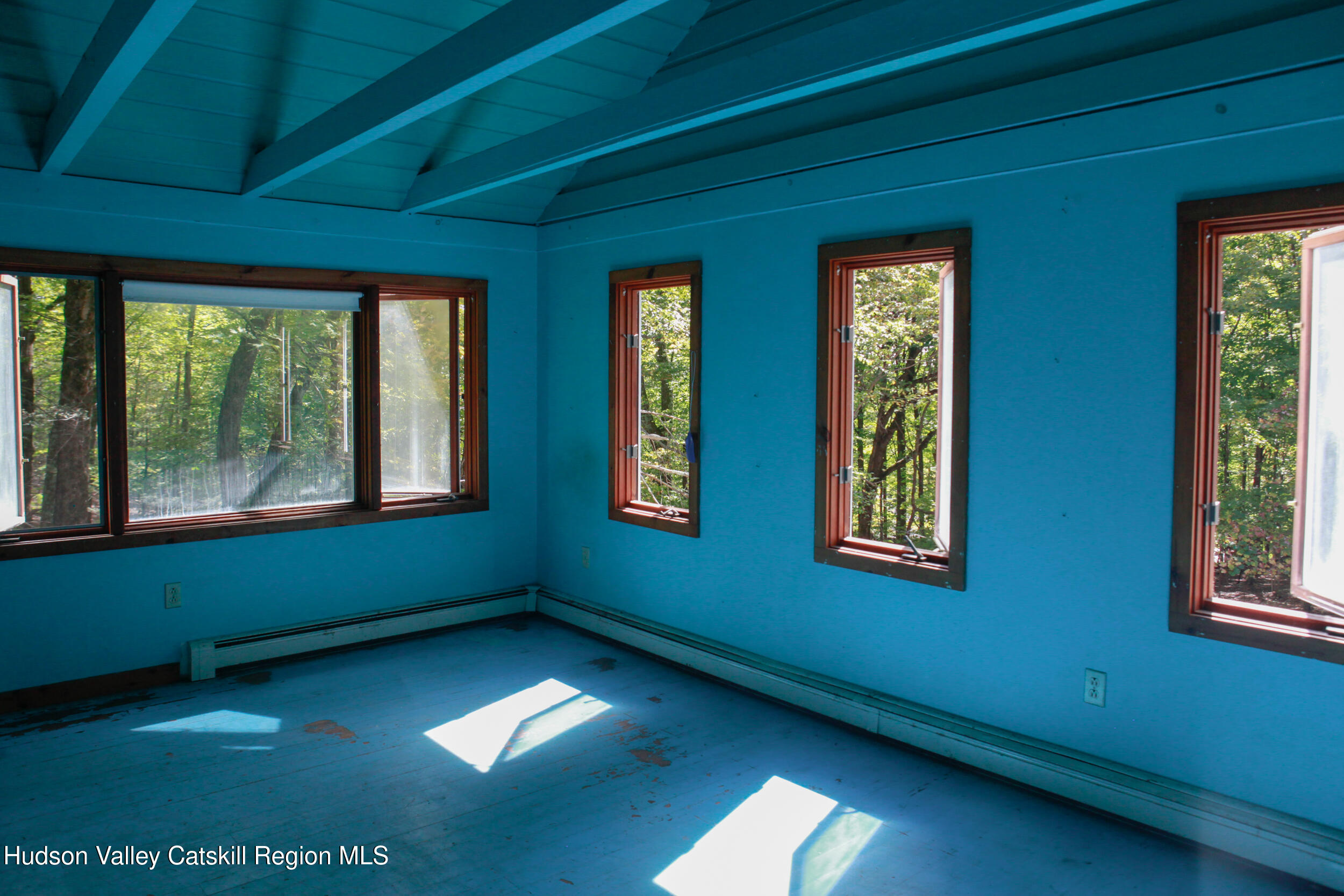 76 Meads Mountain Road Woodstock, NY 12498 - Photo 18 of 28 a view of an empty room with a window