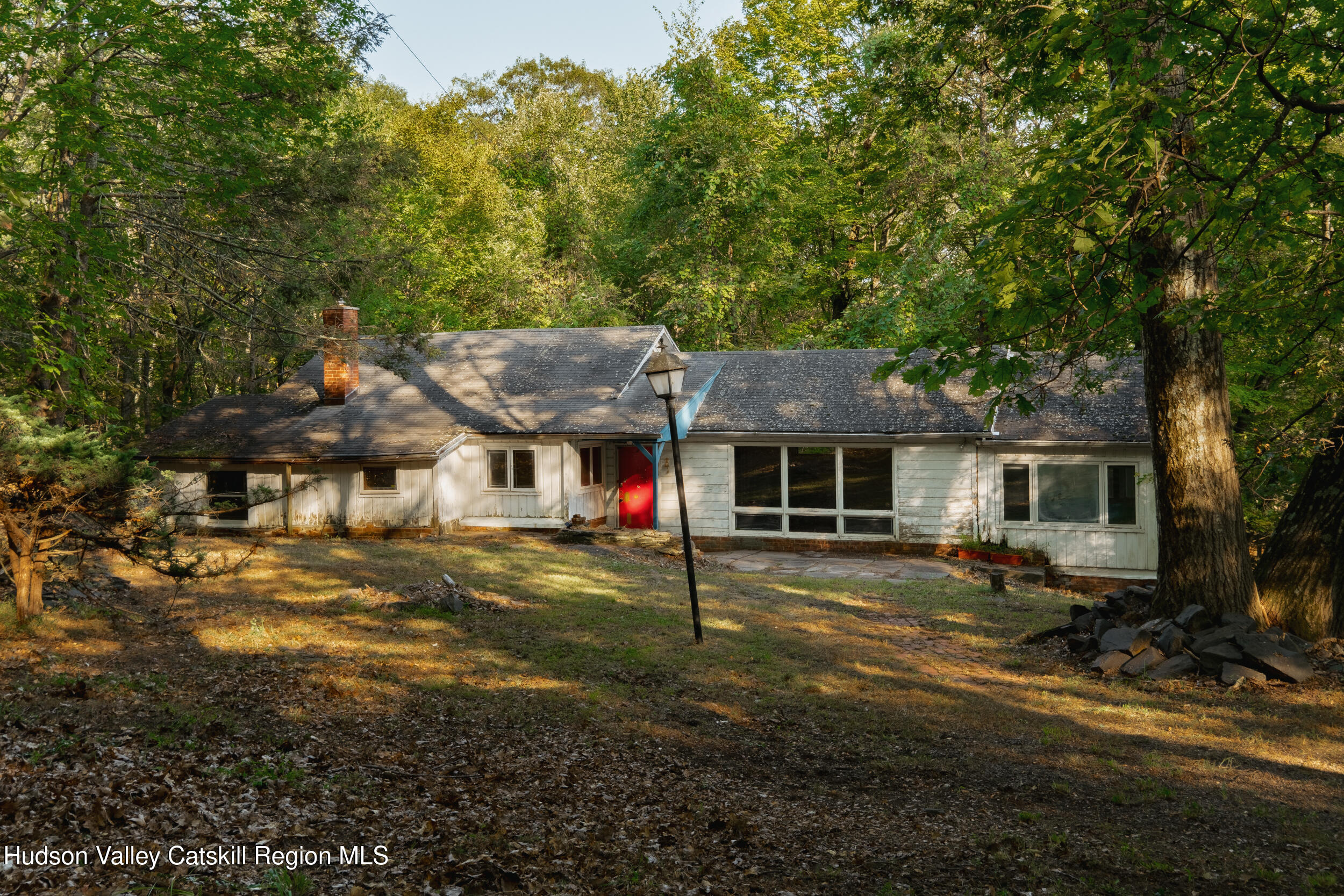 76 Meads Mountain Road Woodstock, NY 12498 - Photo 3 of 28 a front view of a house with a yard