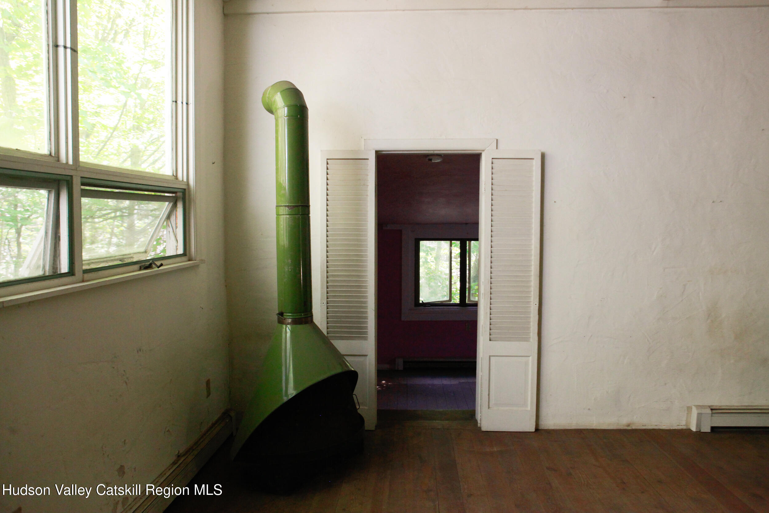 76 Meads Mountain Road Woodstock, NY 12498 - Photo 10 of 28 an empty room with windows