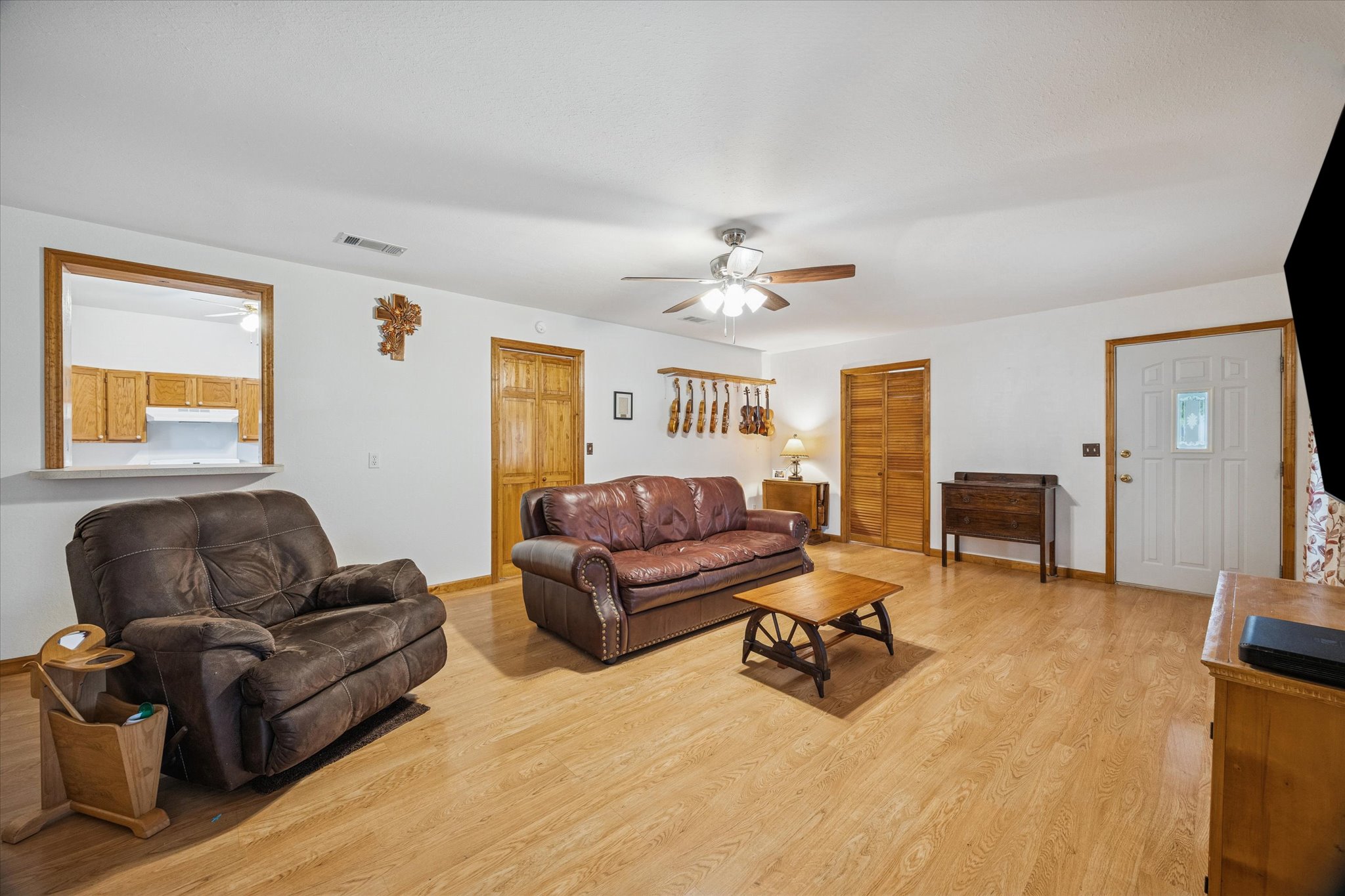 3502 1869th Ranch Liberty Hill, TX 78642 - Photo 8 of 20 Living area with light wood-style floors and a ceiling fan