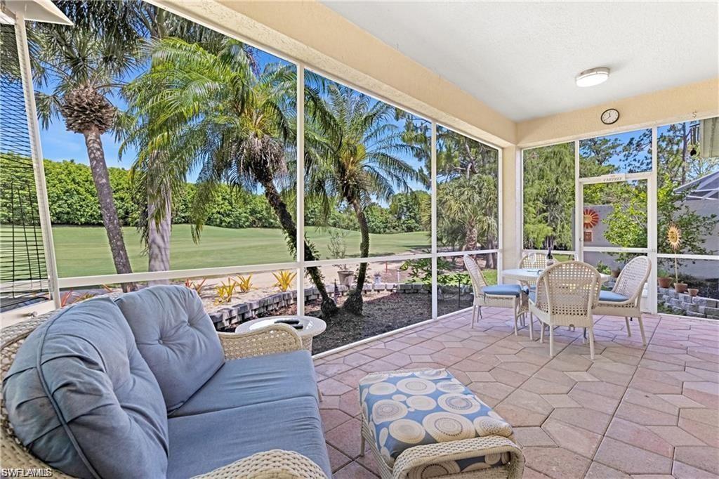 349 Harvard Lane Naples, FL 34104 - Photo 19 of 31 a balcony with furniture and a garden