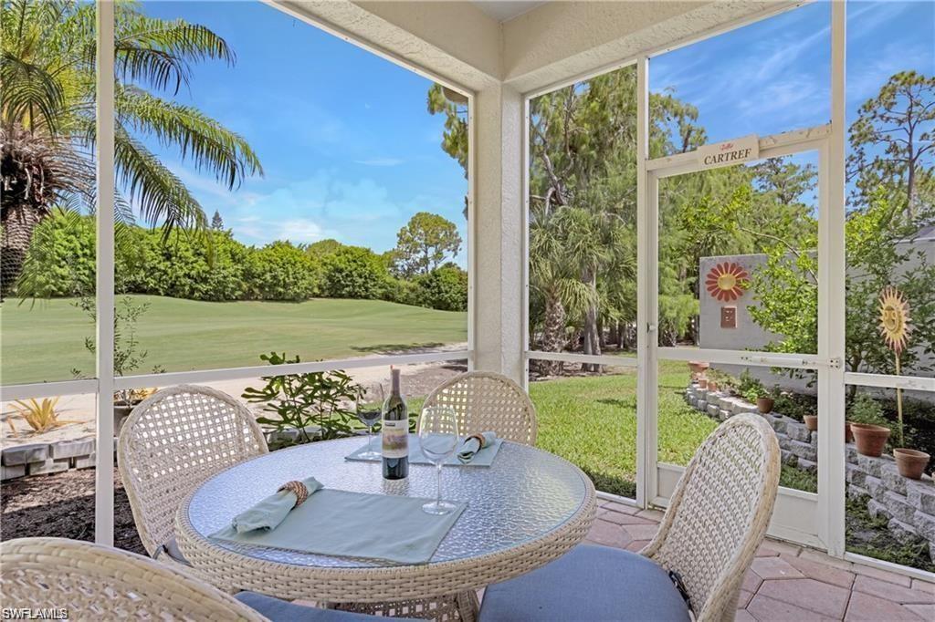 349 Harvard Lane Naples, FL 34104 - Photo 20 of 31 a view of a patio with a table chairs and a swimming pool