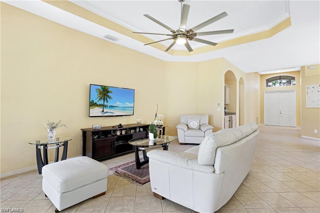 349 Harvard Lane Naples, FL 34104 - Photo 3 of 31 a living room with furniture and a ceiling fan