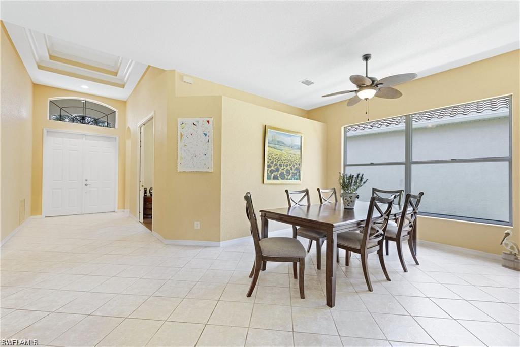 349 Harvard Lane Naples, FL 34104 - Photo 6 of 31 a dining room with furniture and window
