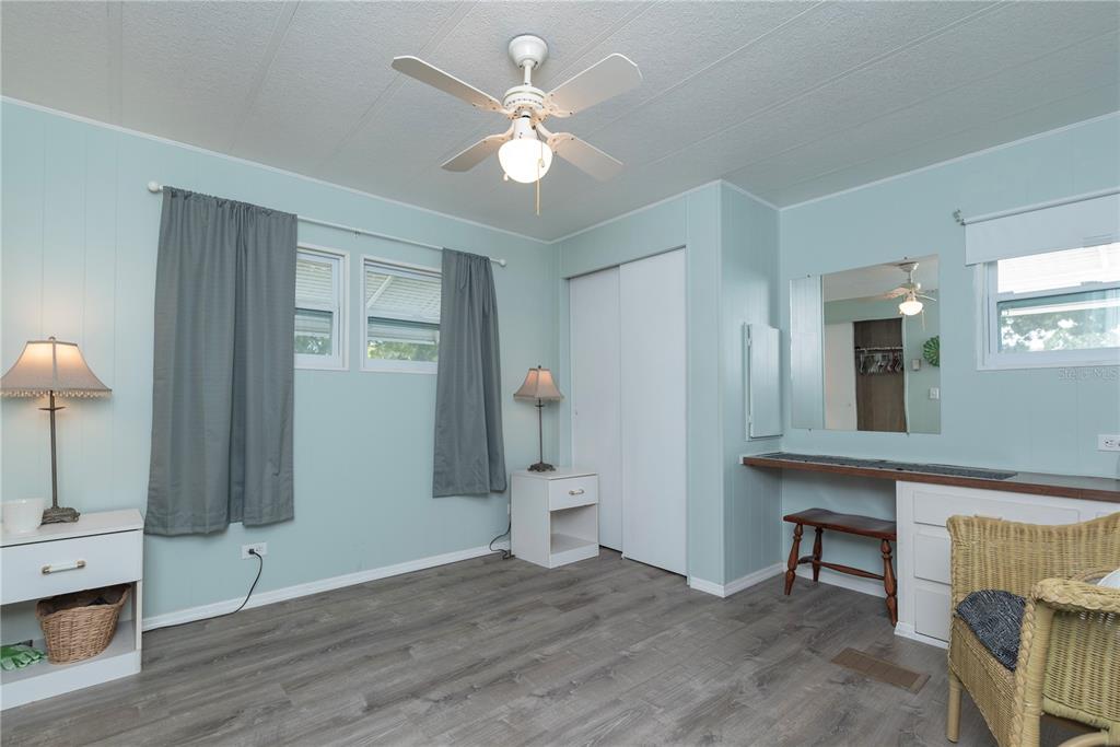 3301 Alt 19, Unit 404 Dunedin, FL 34698 - Photo 11 of 67 a view of a livingroom with furniture and chandelier fan