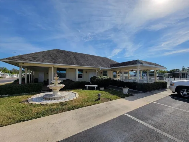 a view of a swimming pool with a lounge chair