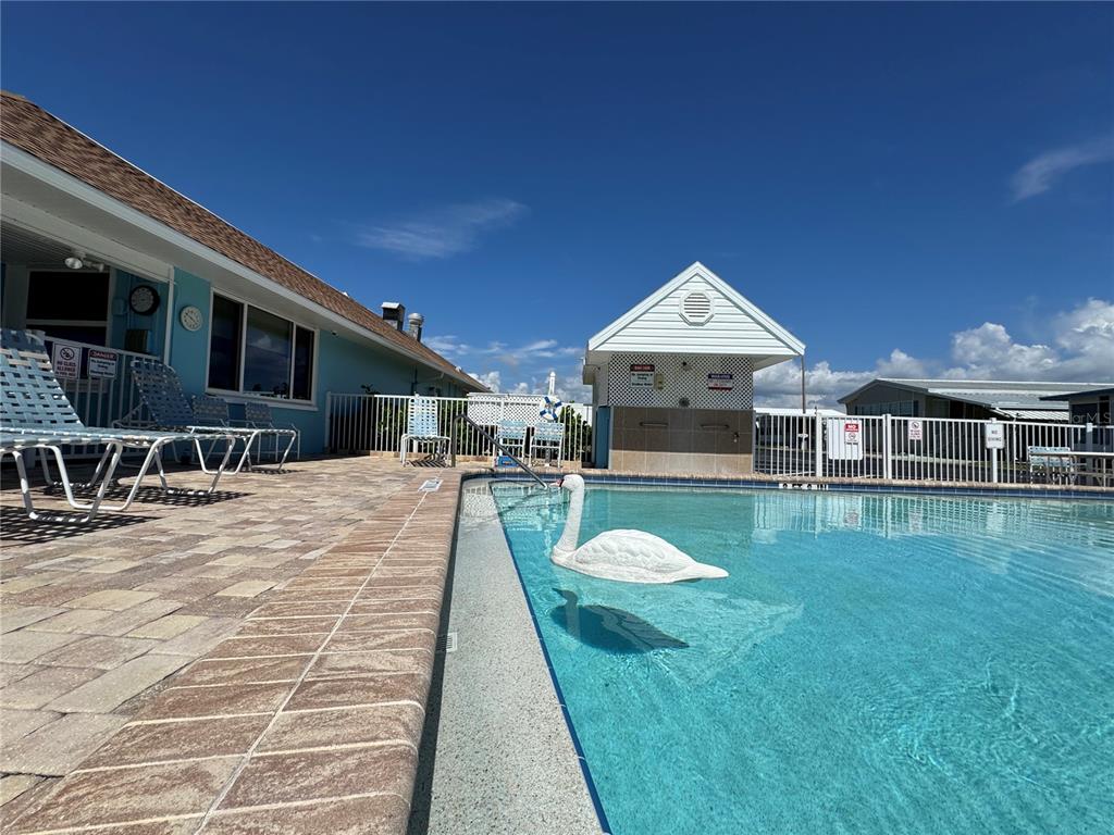 3301 Alt 19, Unit 404 Dunedin, FL 34698 - Photo 26 of 67 a front view of a house with yard porch and patio
