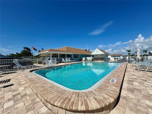 a view of a swimming pool with a patio