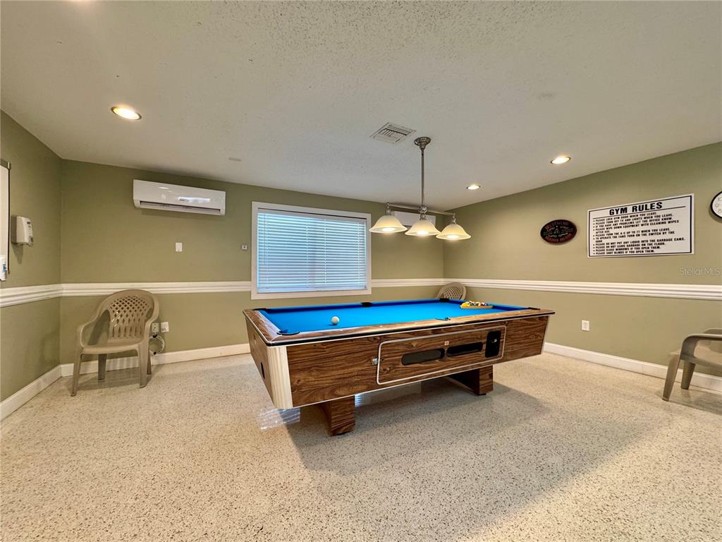 3301 Alt 19, Unit 404 Dunedin, FL 34698 - Photo 38 of 67 a room with pool table and windows