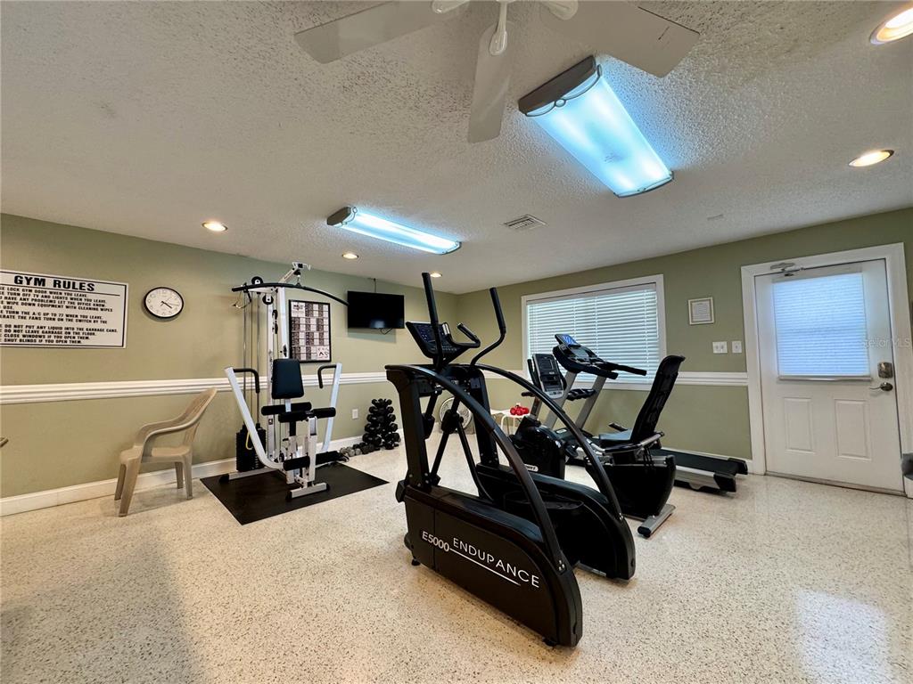 3301 Alt 19, Unit 404 Dunedin, FL 34698 - Photo 39 of 67 a view of a room with gym equipment