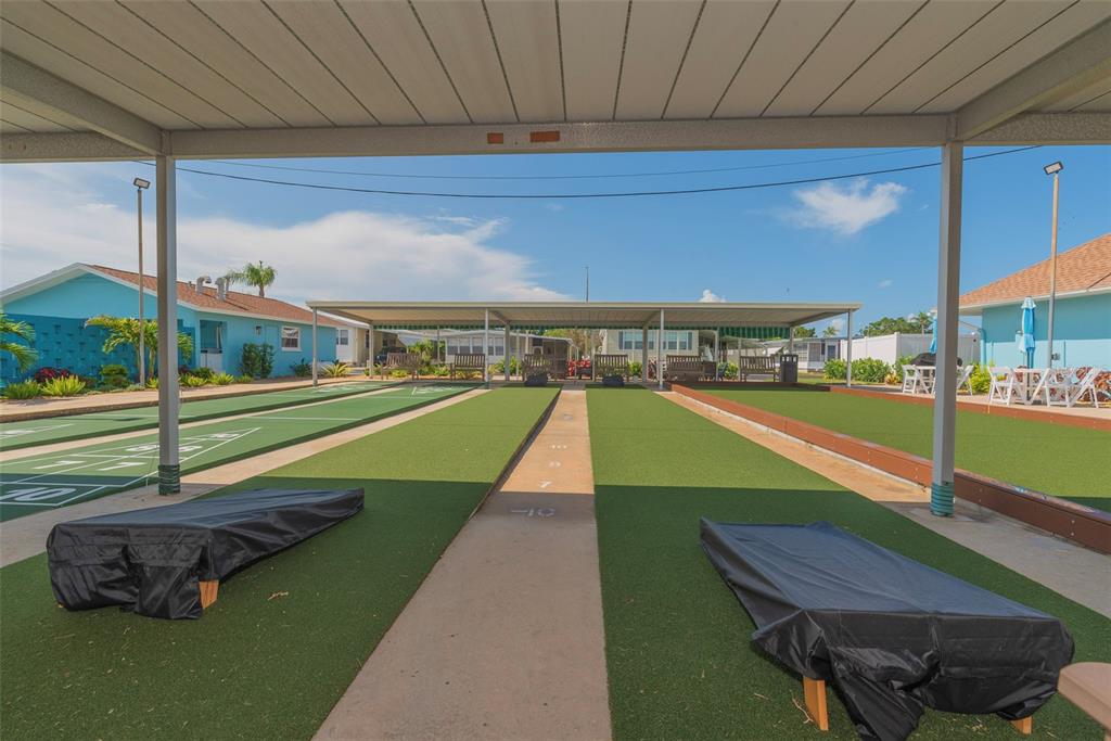 3301 Alt 19, Unit 404 Dunedin, FL 34698 - Photo 40 of 67 a view of a swimming pool with a patio