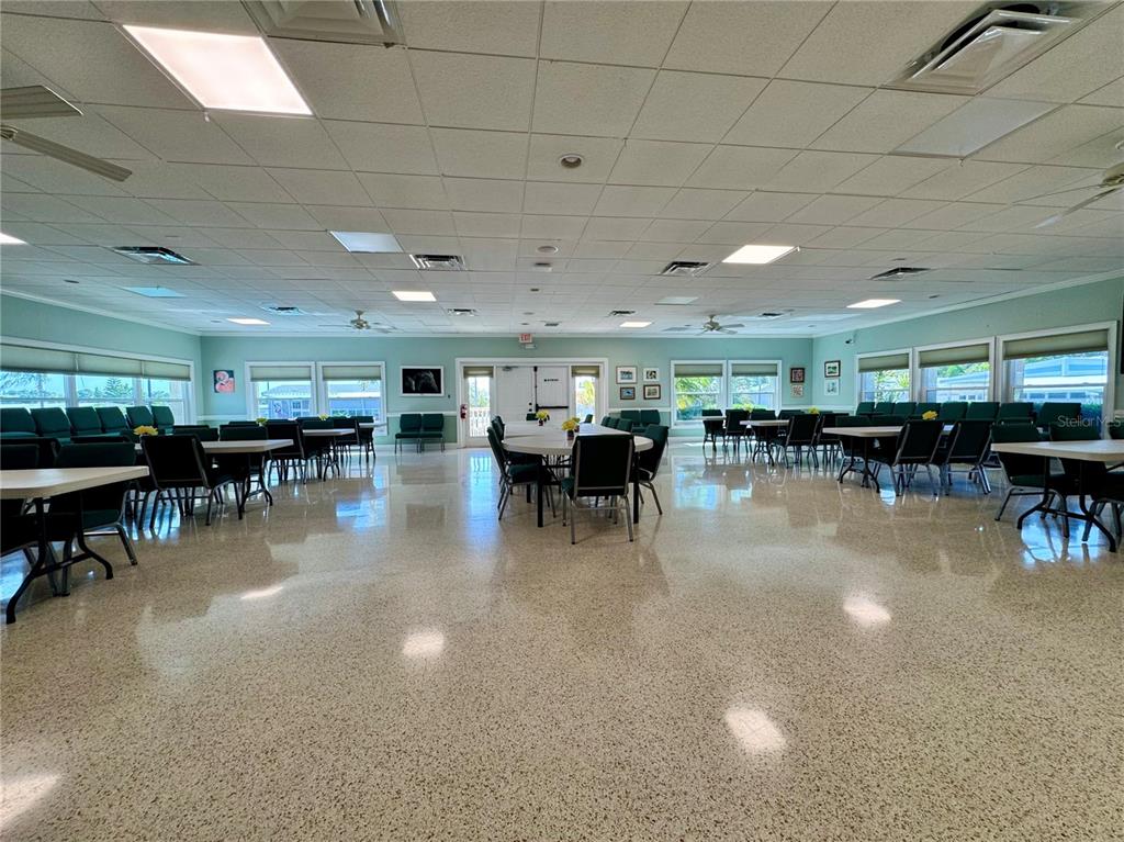 3301 Alt 19, Unit 404 Dunedin, FL 34698 - Photo 51 of 67 a gym with lots of furniture and lots of tables