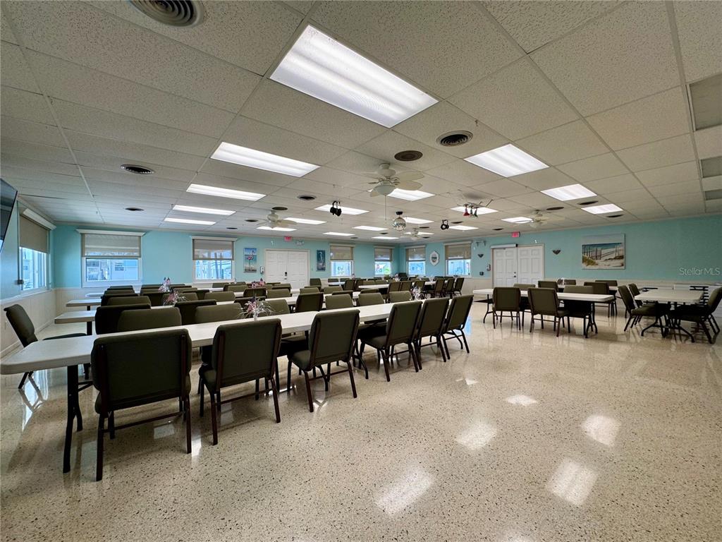 3301 Alt 19, Unit 404 Dunedin, FL 34698 - Photo 52 of 67 a group of people sitting in a room