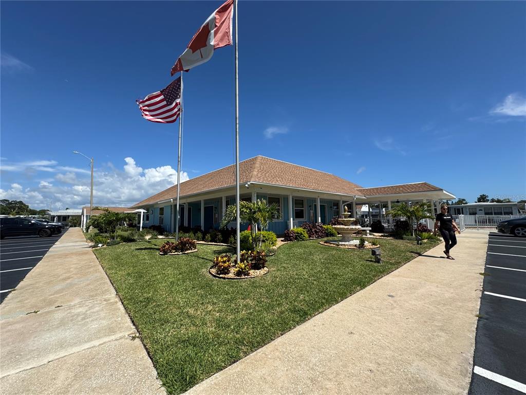 3301 Alt 19, Unit 404 Dunedin, FL 34698 - Photo 64 of 67 a view of a house with backyard porch and sitting area