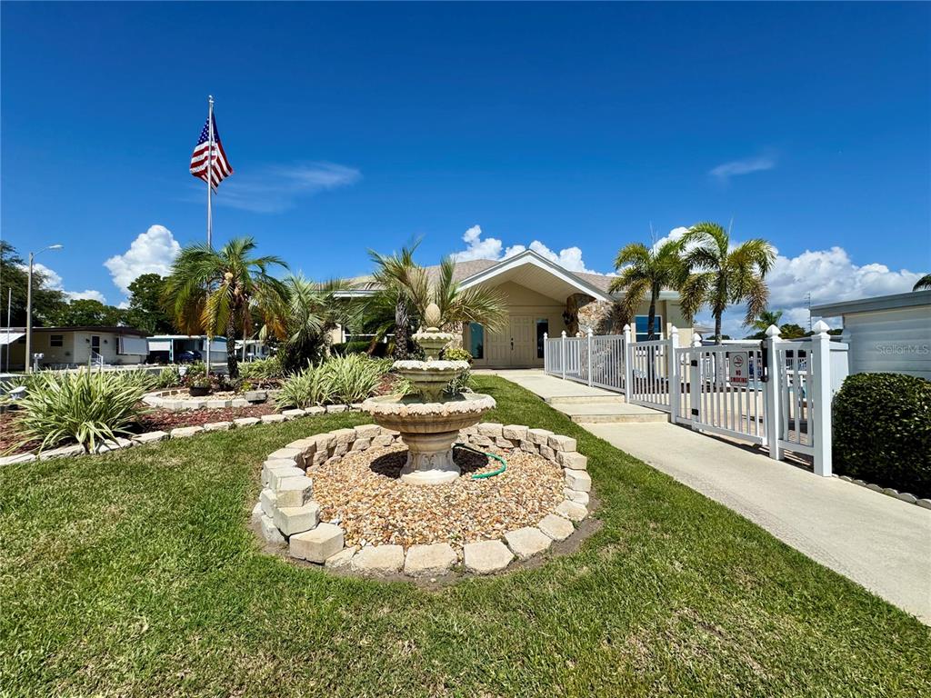 3301 Alt 19, Unit 404 Dunedin, FL 34698 - Photo 66 of 67 a view of a house with a yard