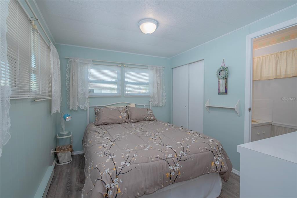 3301 Alt 19, Unit 404 Dunedin, FL 34698 - Photo 10 of 67 a bedroom with a bed and a window