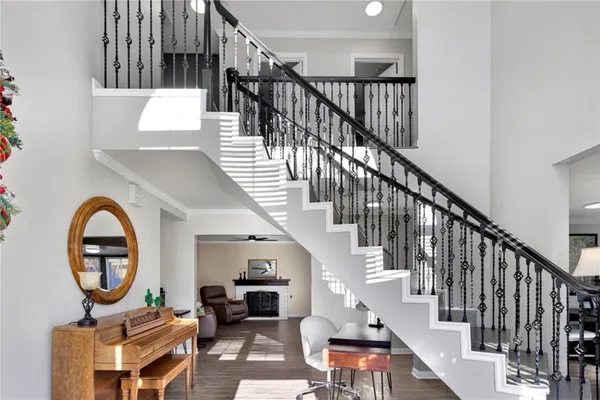 a view of entryway livingroom and hall with wooden floor