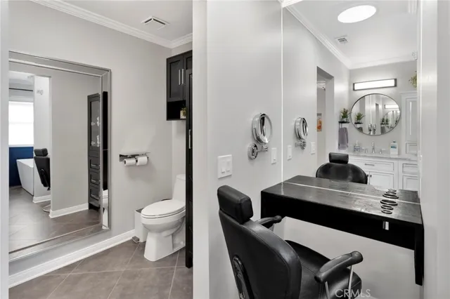 a living room with furniture and a toilet