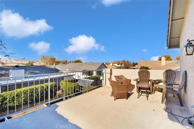 a view of a patio with a table and chairs