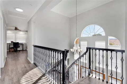 a view of a livingroom with furniture and staircase