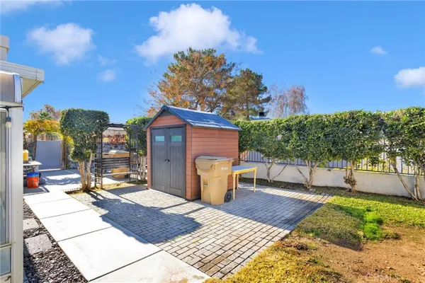 a view of a backyard with sitting area