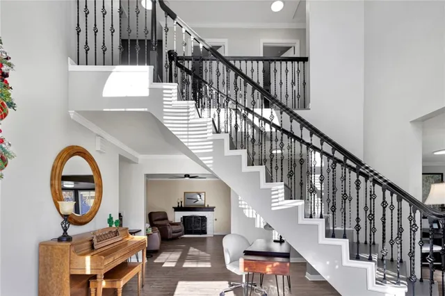 a view of entryway livingroom and hall with wooden floor